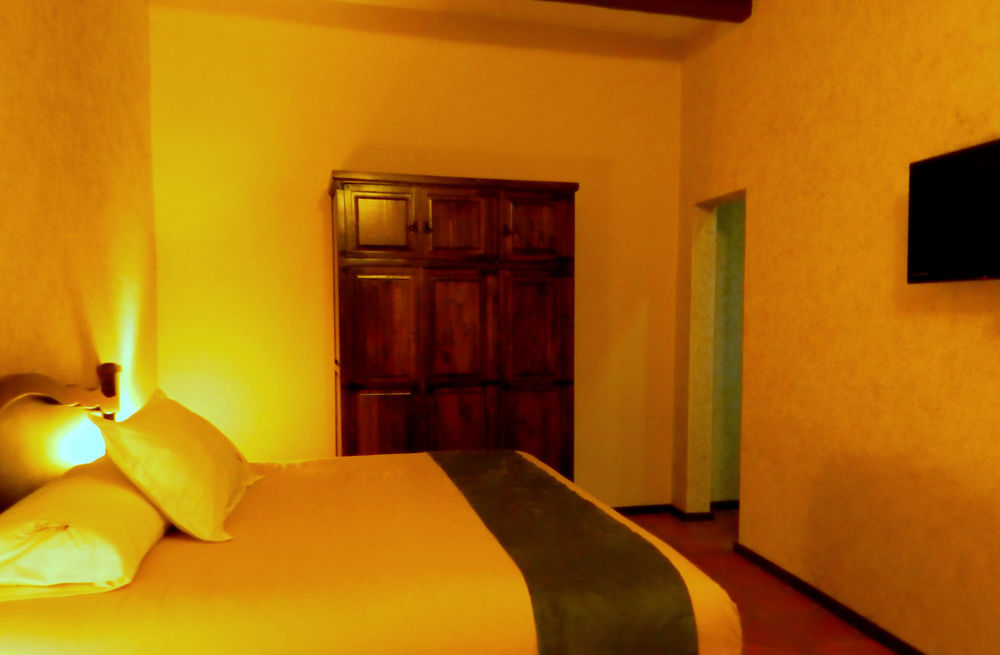 Collection O Al Otro Lado Del Rio, Puebla Hotell Exteriör bild A room at the hotel